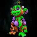 A creepy-cute Frankenstein monkey figure with green, orange, and purple stitched patches and metal bolts on its head.