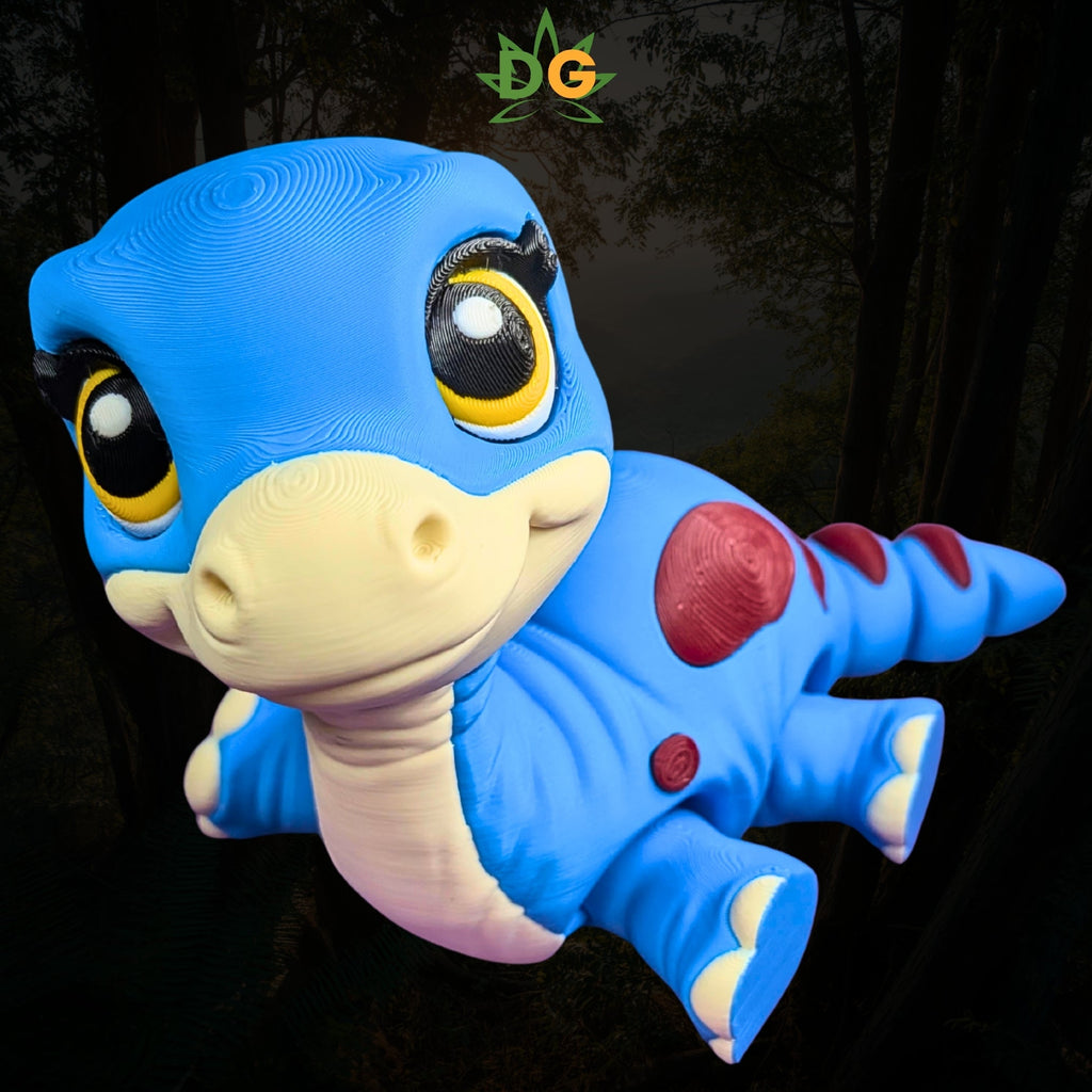 3D-printed blue baby brachiosaurus toy with large eyes and red spots.