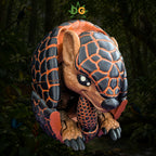 A 3D-printed XL Armadillo Flexi Figure with black and orange scales, curled into a ball against a jungle background.