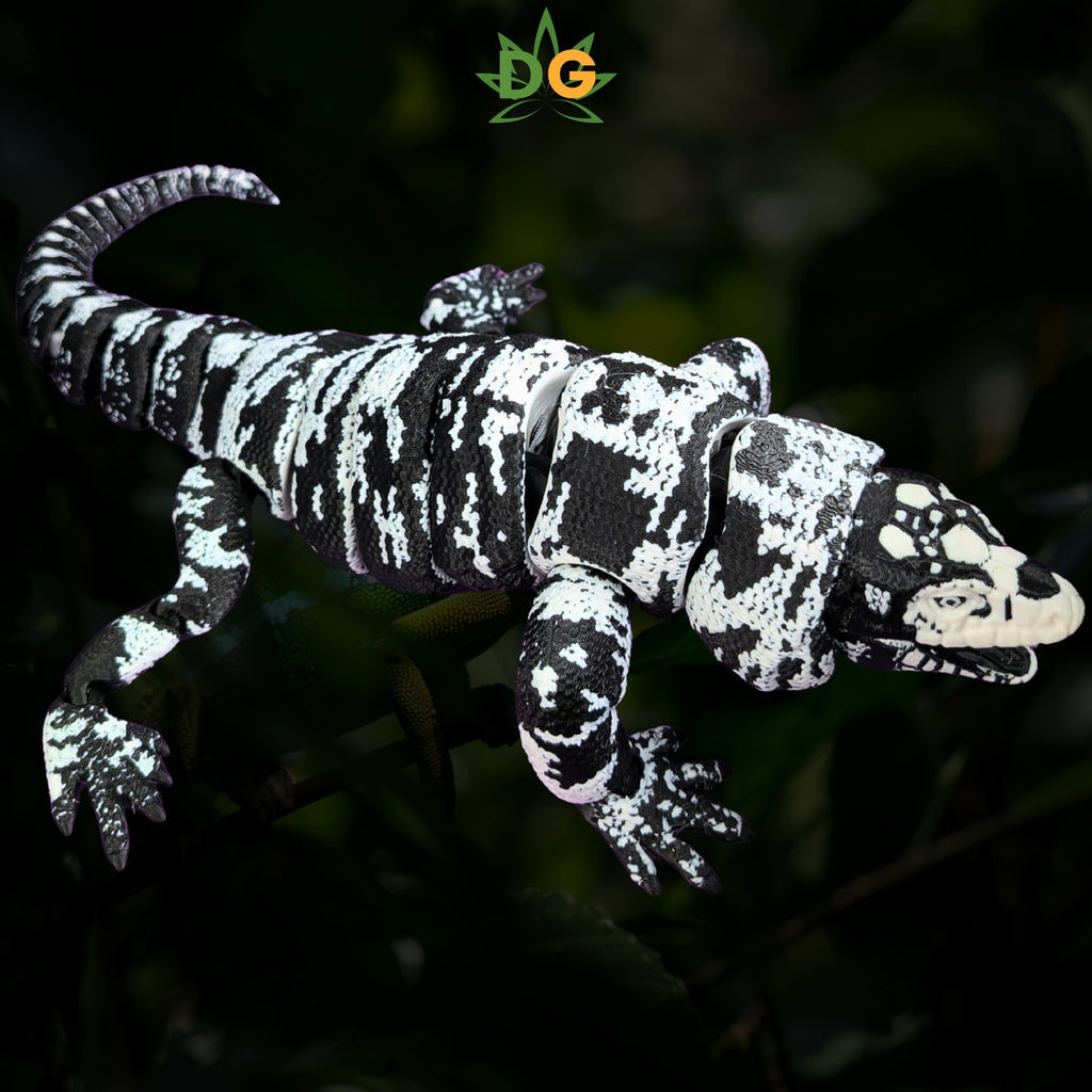 Articulated 3D printed Tegu lizard toy with a black and white marbled pattern.