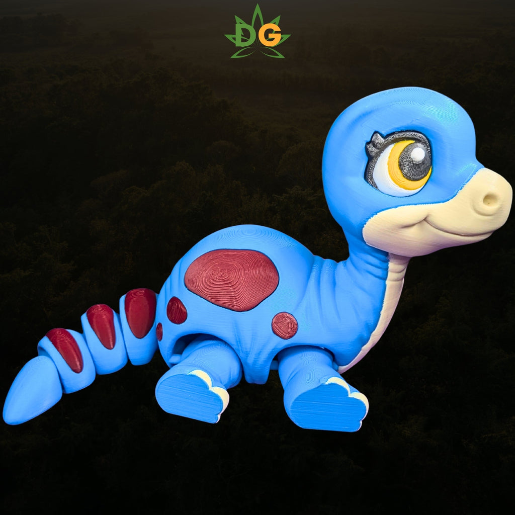 A 3D-printed blue baby brachiosaurus toy with large eyes and red spots on its back and tail.