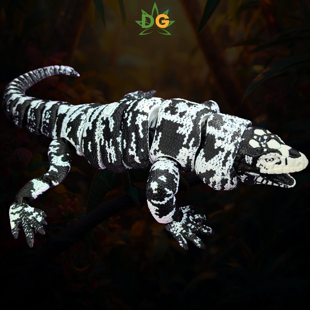 Articulated black and white Tegu lizard figurine perched on a branch.