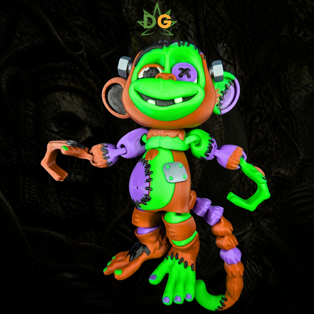 An articulated, multi-colored Frankenstein monkey fidget toy with stitches and metallic bolts on its head.