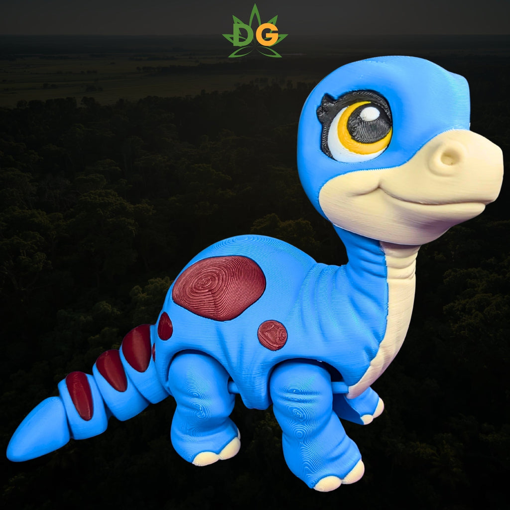 A 3D-printed blue baby brachiosaurus toy with large eyes and red spots on its back.