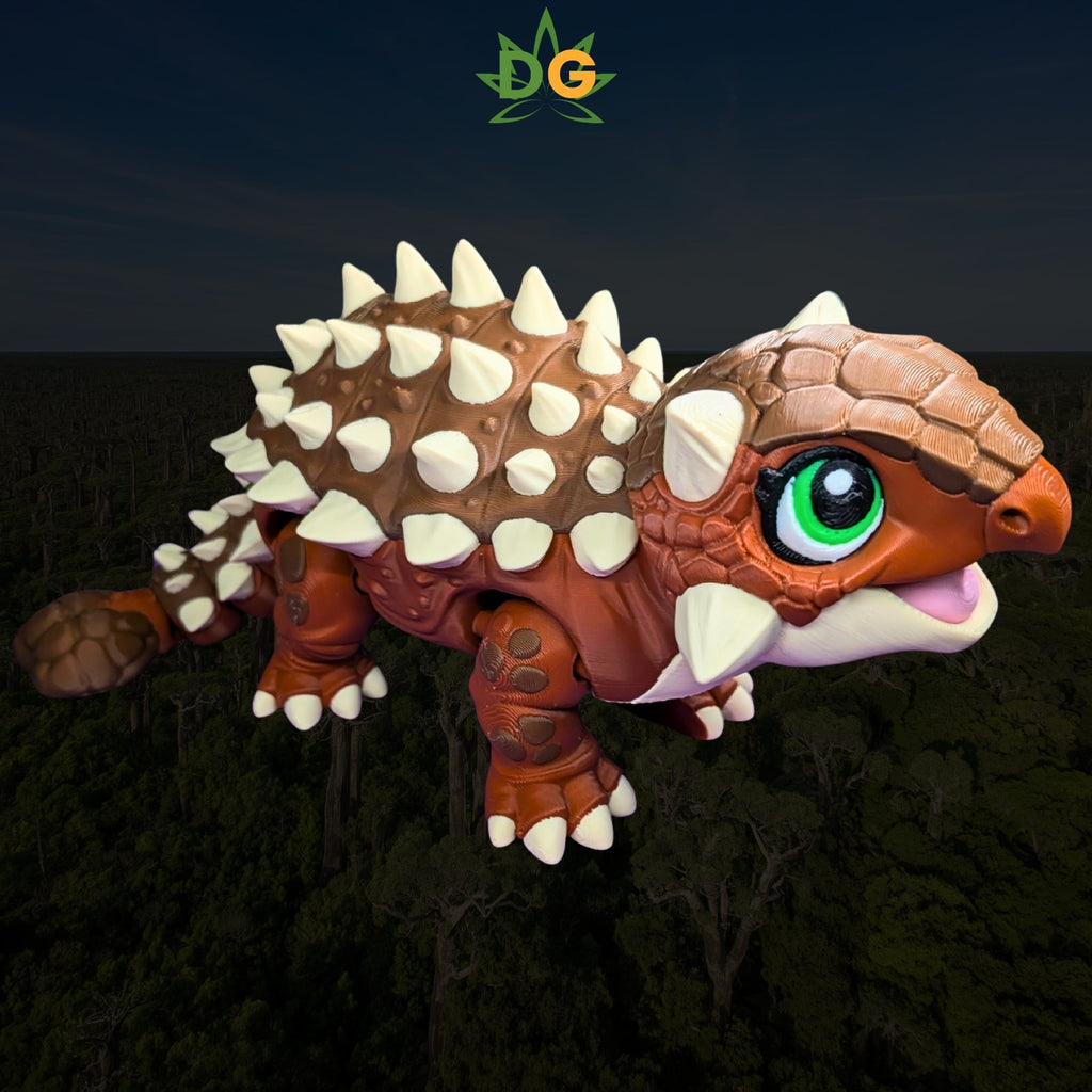 A small, brown, 3D-printed articulated ankylosaurus toy with large green eyes against a forest background.