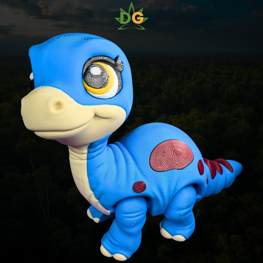 A 3D-printed blue baby brachiosaurus toy with large eyes, a cream-colored snout, and red spots.