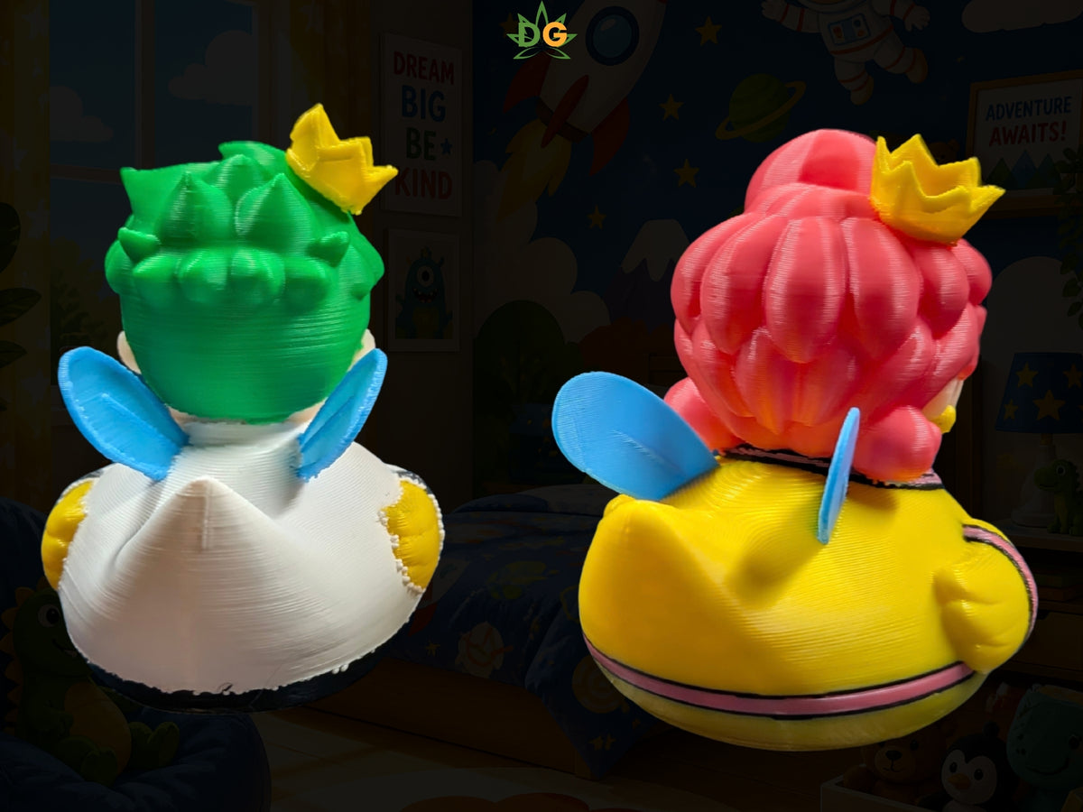 Two 3D-printed fairy ducks shaped like Mario characters, seen from behind with crowns and small wings.